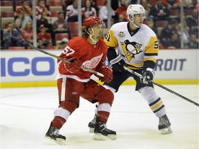 The Vancouver Canucks have acquired defenceman Derrick Pouliot (right) from the Pittsburgh Penguins, giving up rearguard Andrey Pedan.