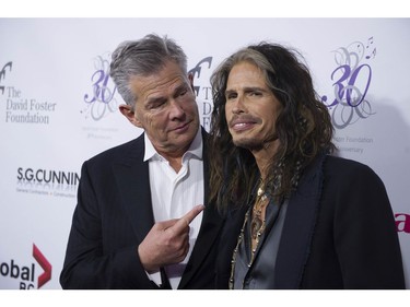 Vancouver, BC: OCTOBER 21, 2017 -- Steven Tyler with David Foster on the red carpet at the David Foster Foundation 30th Anniversary Miracle Gale and Concert, at Rogers Arena in Vancouver, BC Saturday, October 21, 2017.  (Photo by Jason Payne/ PNG) (For story by reporter) ORG XMIT: davidfosterredcarpet [PNG Merlin Archive]

VANCOUVER OUT
Jason Payne, PNG