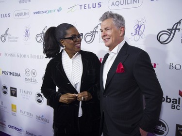 Vancouver, BC: OCTOBER 21, 2017 -- Oprah Winfrey with David Foster on the red carpet at the David Foster Foundation 30th Anniversary Miracle Gale and Concert, at Rogers Arena in Vancouver, BC Saturday, October 21, 2017.  (Photo by Jason Payne/ PNG) (For story by reporter) ORG XMIT: davidfosterredcarpet [PNG Merlin Archive]

VANCOUVER OUT
Jason Payne, PNG