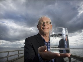 White Rock will hold an open house on Thursday to let the public know more about how it will remove arsenic and manganese from the city's drinking water. White Rock Mayor Wayne Baldwin holds a glass of the city's tap water.