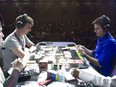 Simon Narode of the USA (left) squares off against Jason Klaczynski of the USA during the finals in the Masters Division of the Trading Card Game at the Pokemon World Championships held at the Vancouver Convention Centre in August 2013.