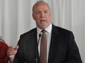 Premier John Horgan, trying to cool the heat his agriculture minister has been taking over fish farms, announced Wednesday his office will take over the file. He was called the "minister of defence" by the rival Liberals for doing so.