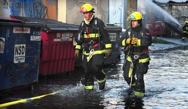 Vancouver Fire Department fighting a two alarm fire on East 3rd Ave between Ontario and Quebec St in Vancouver, BC, Oct. 3, 2017.