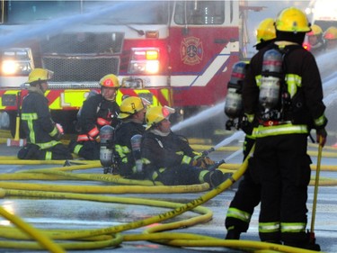 Vancouver Fire Department fighting a two alarm fire on East 3rd Ave between Ontario and Quebec St in Vancouver, BC., October 3, 2017. Several explosions were heard from an Auto repair shop and a Doggie Daycare next door was evacuated with no injuries reported.