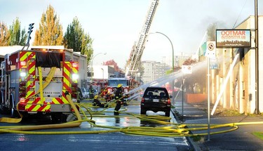 Vancouver Fire Department fighting a two alarm fire on East 3rd Ave between Ontario and Quebec St in Vancouver, BC, Oct. 3, 2017.