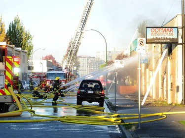 VANCOUVER, BC., October 4, 2017 -- Vancouver Fire Department fighting a two alarm fire on East 3rd Ave between Ontario and Quebec St in Vancouver, BC., October 3, 2017. Several explosions were heard from an Auto repair shop and a Doggie Daycare next door was evacuated with no injuries reported. (NICK PROCAYLO/PostMedia)  00050865A ORG XMIT: 00050865A [PNG Merlin Archive]
Nick Procaylo, PNG