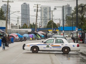 A Health Solutions Clinic is situated near tents that are set up along 135A Street in Surrey on Oct. 12.