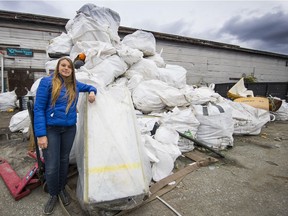 Chloe Dubois, executive director of Ocean Legacy Foundation, stands with a fraction of the debris brought in for recycling from B.C.'s beaches.