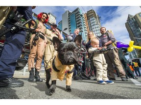 Felix the dog is a Ghost Buster. People dress up for the Halloween Parade in downtown Vancouver, B.C., October 15, 2017.