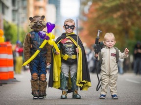 Left to right: Kosta, 5, Zachery, 5 and Parker, 1. People dress up for the Halloween Parade in downtown Vancouver, B.C., October 15, 2017.