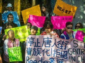 Chinatown residents rally in front of City Hall in Vancouver, B.C., October 30, 2017.  A revised plan for 105 Keefer St.  went before the development permit board today.