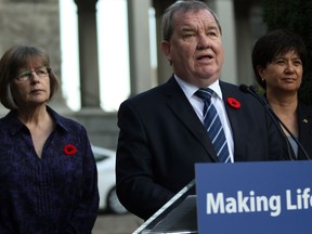 Minister of Social Development and Poverty Reduction Shane Simpson is joined by UNBC chair Dawn Hemingway, (left), and Parliamentary Secretary and co-chair Mable Elmore as they discuss details of an advisory forum on poverty reduction during a press conference from the Rose Garden at Legislature in Victoria, B.C., on Monday, October 30, 2017.