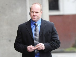 Former police officer Derek Brassington arrives at B.C. Provincial Court at Vancouver in December 2013.