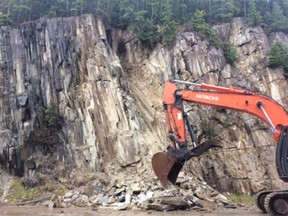 Geotechnical engineers have arrived at the site of a rock slide that has closed the Trans-Canada Highway in southeastern British Columbia. Crews are cleaning up the slide in this photo.