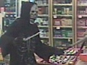 Nanaimo RCMP is investigating a robbery of a local beer and wine store in which a masked man armed with a knife and bat, made off with an undisclosed amount of cash.
