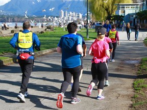 An InTraining clinic goes for a jog along the waterfront in Vancouver.