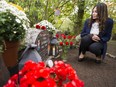 Eileen Mohan graveside at her son, Christopher's headstone in the Valley View cemetery in Surrey on Oct. 11, 2017.