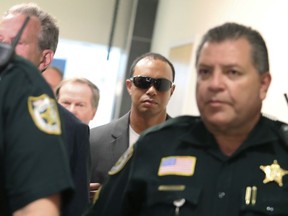 Tiger Woods makes his way into a North County Courthouse courtroom in Palm Beach Gardens, Fla., on Friday Oct. 27, 2017, to plead guilty to a second-degree misdemeanour reckless driving charge.