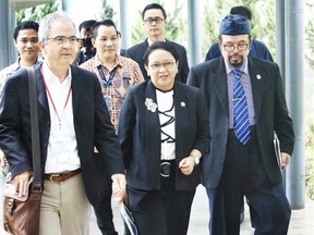 The Vancouver Sun's Douglas Todd walks with Indonesia's Foreign Minister, Retno Marsudi (second from left), as well as Multimedia Nusantara University rector Ninok Leksono. "For a diverse country like Indonesia," Marsudi says, "harmony is a must, otherwise it cannot survive."