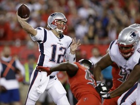 New England Patriots quarterback Tom Brady (12) throws a pass against the Tampa Bay Buccaneers during the first quarter of an NFL football game Thursday, Oct. 5, 2017, in Tampa, Fla. (AP Photo/Chris O'Meara)