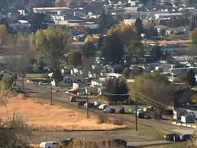 Kamloops Mounties converge on the G&M Trailer Park Friday morning following reports of a man with a gun who may have taken shots at nearby construction workers.