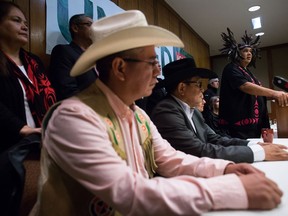 Rueben George, back right, Project Manager for the Tsleil-Waututh Nation Sacred Trust Initiative, speaks as First Nations and environmental groups speak about a federal court hearing about the Kinder Morgan Trans Mountain pipeline expansion, during a news conference in Vancouver, B.C., on Monday October 2, 2017. T