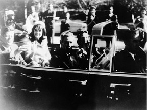 This image provided by the Warren commission, shows Warren Commission Exhibit No. 697, President John F. Kennedy at the extreme right on rear seat of his limousine during Dallas, motorcade on Nov. 22, 1963. His wife, Jacqueline, beside him, Gov. John Connally of Texas and his wife were on jump seats in front of the president.