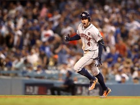 Houston Astros outfielder George Springer celebrates his 11th-inning home run against the Los Angeles Dodgers on Oct. 25.