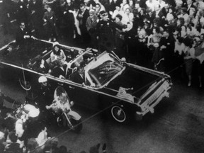 This image provided by the Warren Commission is an overhead view of President John F. Kennedy's car in Dallas motorcade on Nov. 22, 1963, and was the commission's Exhibit No. 698. Special agent Clinton J. Hill is shown riding atop the rear of the limousine. President Donald Trump is caught in a push-pull on new details of Kennedy's assassination, jammed between students of the killing who want every scrap of information and intelligence agencies that are said to be counseling restraint. How that plays out should be known on Oct. 26, 2017, when long-secret files are expected to be released. (Warren Commission via AP)