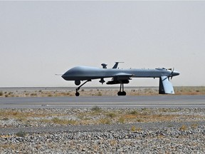 A US Predator unmanned drone armed with a missile.