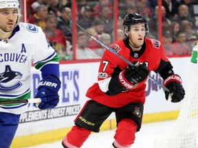 In this Oct. 17 file photo, Ottawa Senators centre Kyle Turris (right) skates against the Vancouver Canucks.