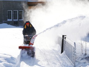 Fabio Calabrese uses a snowblower to clear a path at Holy Redeemer Catholic Church in Sudbury, Ont. last winter.