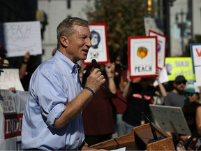 Billionaire Tom Steyer speaks during a rally and press conference at San Francisco City Hall on October 24, 2017. Steyer has launched a $10-million campaign calling on the impeachment of the president.