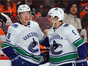 Brock Boeser of the Vancouver Canucks, left, scored two goals Tuesday as he and teammate Derrick Pouliot enjoyed a 5-2 victory in Philadelphia to open a six-game road trip.