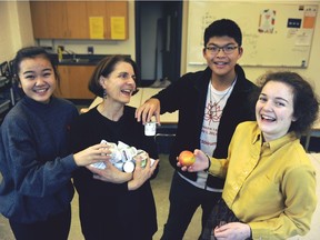 The breakfast program at Vancouver Technical Secondary School was launched by students, from the left: Sakura Kubota, 15, David Zhang, 15, and 14-year-old Rosemary Taylor. Van Tech principal Annette Vey-Chilton (second from left) said the school has 1,650 students and says about 400 have "food security" concerns.
