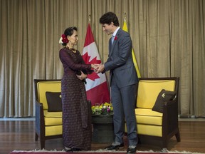 Canadian Prime Minister Justin Trudeau shakes hands with Myanmar leader Aung San Suu Kyi before a bilateral meeting at the APEC Summit in Danang, Vietnam Friday November 10, 2017. THE CANADIAN PRESS/Adrian Wyld