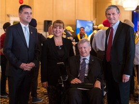 B.C. Liberal leadership candidates Todd Stone, from left to right, Dianne Watts, Sam Sullivan and Andrew Wilkinson stand together before the first leadership debate in Surrey, B.C., on Sunday October 15, 2017.