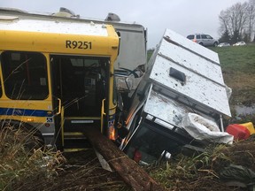 A TransLink bus and another vehicle ended up in a ditch on the side of Hwy. 99 in Surrey on Sunday.