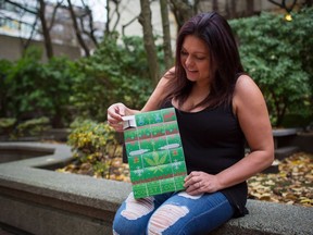 Lorilee Fedler, owner of Coast to Coast Medicinals, is pictured with her cannabis Christmas calendars in Vancouver on Saturday, Nov. 25, 2017.