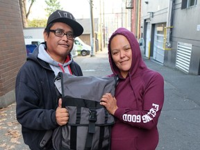 Christine and William display the Citypak they received from Union Gospel Mission on Wednesday.