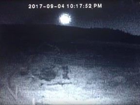 A screengrab from a YouTube video taken from a security camera in Bridge Lake, B.C. and posted by Jacquie McKay is shown in a handout. Researchers, including some from the University of Calgary, have found chunks of space rock that landed in the rugged B.C. Interior more than two months ago. A fireball lit up the sky over parts of Western Canada Sept. 4 and some witnesses reported hearing a loud boom.