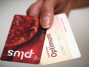 A Loblaws PC Plus and a Shoppers Drug Mart Optimum card. Loblaw says it will merge Shoppers Optimum points and PC Plus points under the name PC Optimum starting in February.