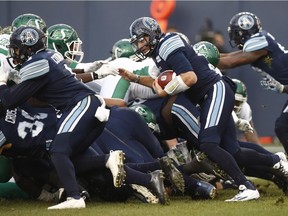 Toronto Argonauts quarterback Cody Fajardo runs in the game-winning touchdown against the Saskatchewan Roughriders in the final minute of Sunday’s CFL East Division final in Toronto.