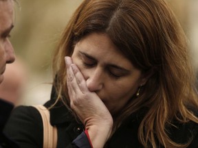 Marta Pascal, member of the pro Catalonia independence PDeCAT political party, gestures outside the National Court in Madrid, Thursday, Nov. 2, 2017. The defense lawyers of nine former members of the Catalan regional government ordered jailed by a Spanish court says the defendants are "serene" and that they asked their lawyers to convey a call for calm to the people of Catalonia, and for any protests over the jailings to happen "without violence of any type." (AP Photo/Francisco Seco)