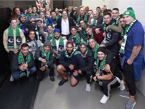 Vancouver Canucks owner Francesco Aquilini poses with the Maori All Blacks rugby team before the NHL game between the Vancouver Canucks and the Dallas Stars at Rogers Arena on Oct. 30.