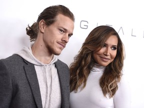 Ryan Dorsey (left) and Naya Rivera arrive at an event at the Beverly Wilshire hotel in Beverly Hills, Calif., in December 2015. Rivera, an actress on the former hit show Glee, was charged with domestic battery on her husband, Dorsey, in Chesapeake, W.V., the Kanawha County Sheriff's Office tweeted Sunday, Nov. 26, 2017.