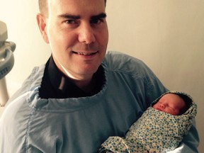 Glen Wood and his newborn son Alexander.