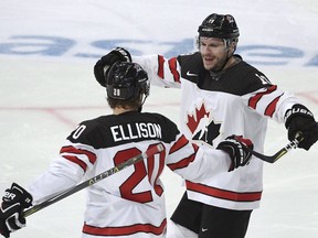 Canada's Matt Ellison, left, and Gilbert Brule celebrate the opening goal by Brule during the Ice Hockey Euro Hockey Tour Karjala Cup match between Finland and Canada in Helsinki, Finland, on Sunday, Nov. 12 2017.