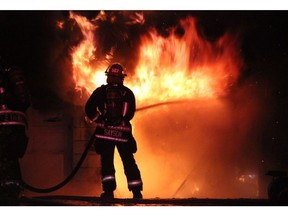 Firefighters battle a large house fire in Surrey early Friday morning. All six members of the same family escaped unharmed.