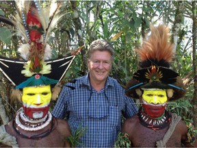 B.C. author Thom Henley posing with Huli wig men in Papua New Guinea. Henley has just released his new memoir, Raven Walks Around the World: Life of a Wandering Activist.